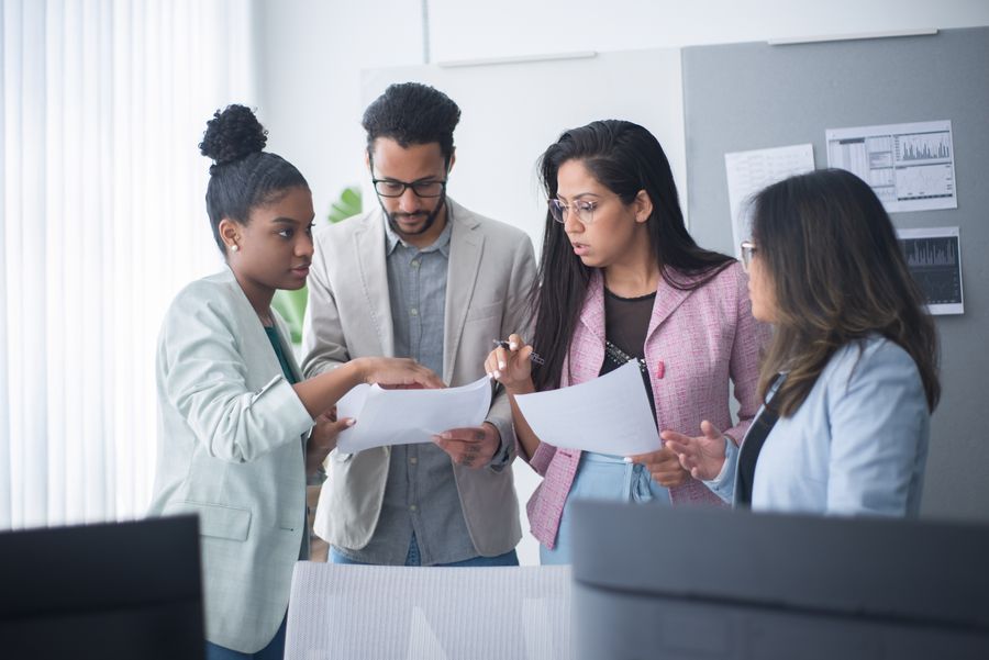 Healthcare professionals discussing care in a team meeting