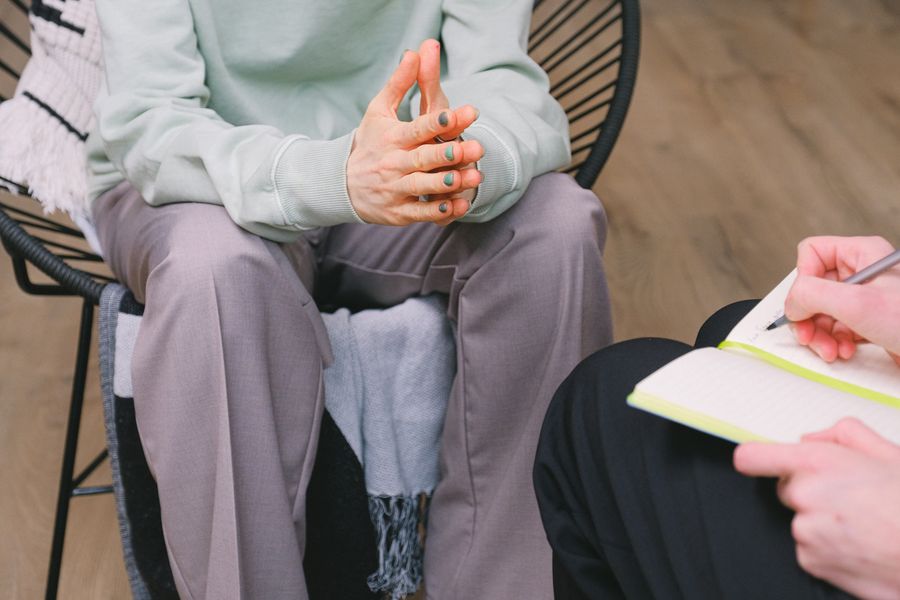 Therapist taking notes during a supervision review